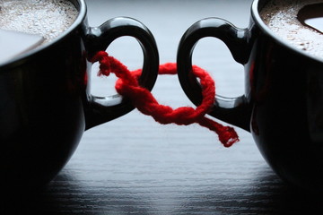 Two cups of coffee related red thread