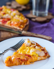 slice of pizza with chicken, corn, tomatoes and double cheese