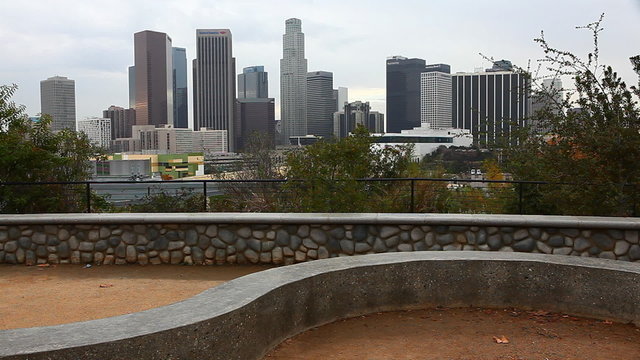 A View of Los Angeles skyline with stone dike in the foreground