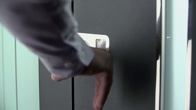 Man rings on white doorbell
