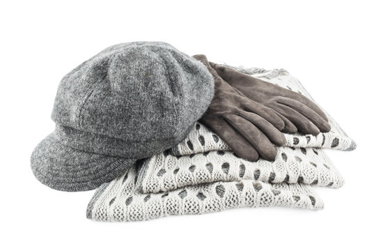 Woolen scarf, cap and gloves isolated on white background