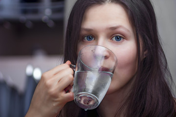 Girl with a glass of water