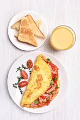 Omelette with vegetables and ham