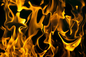 face on fire on a black background