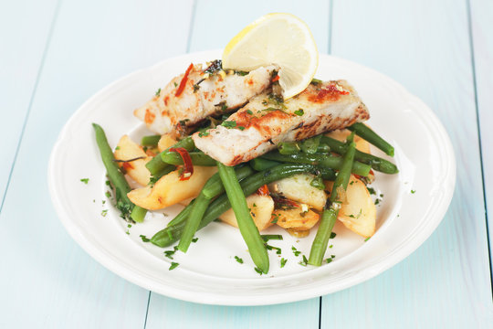 Cod fish steak with potato and green beans