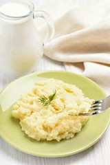 Mashed potato and jug of milk