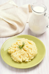 Mashed potato and jug of milk
