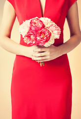 woman hands with bouquet of flowers