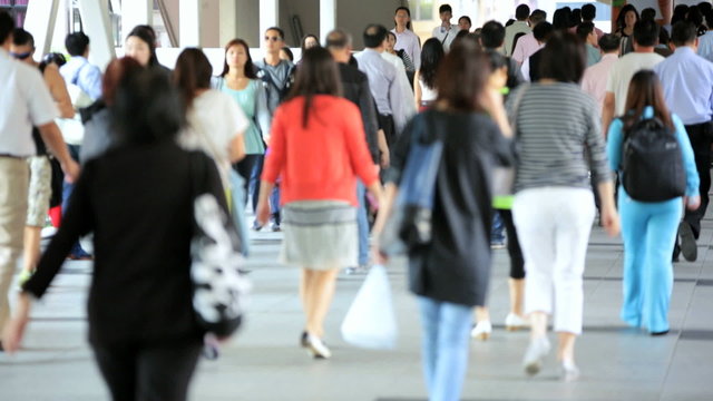 Asian Streets Busy with Walking Commuters