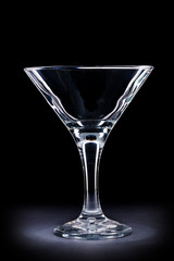 empty wineglass for maritini on black background