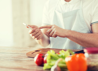 closeup of man pointing finger to smartphone