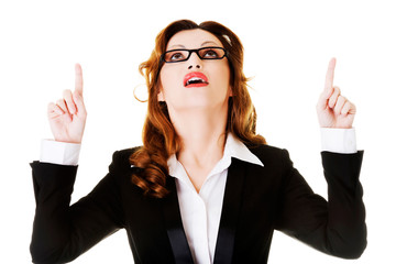 Businesswoman pointing up.