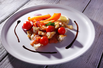 Fresh fish salad with vegetables