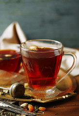 Beautiful vintage composition with herbal tea, on wooden table