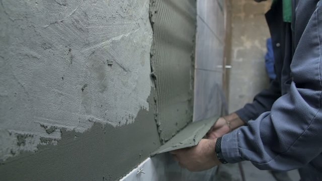 Putting glue on the wall