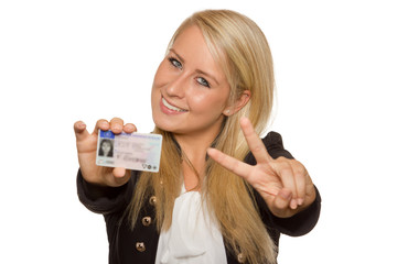 Young woman showing her driver's license - 77405977