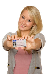 Young woman showing her driver's license - 77406585