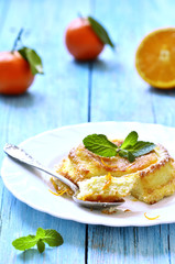 Curd souffle with orange and vanilla.