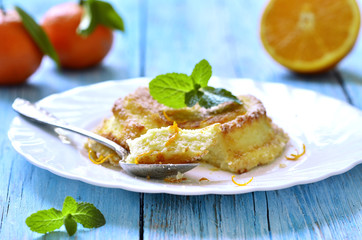 Curd souffle with orange and vanilla.