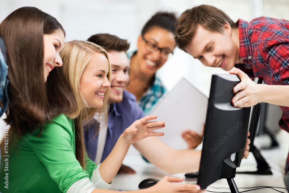 Sticker students looking at computer monitor at school