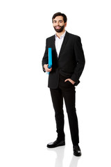 Handsome businessman holding a binder.