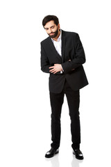 Businessman suffering from stomach pain.