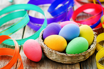 Easter background with colorful eggs and ribbons