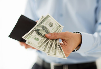 close up of businessman hands holding money