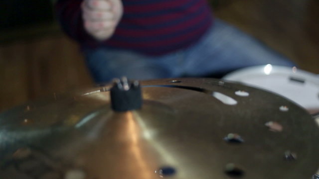 close up shot of musican playing drums