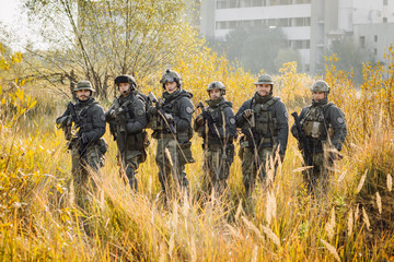 group soldiers stands and Looking At Camera
