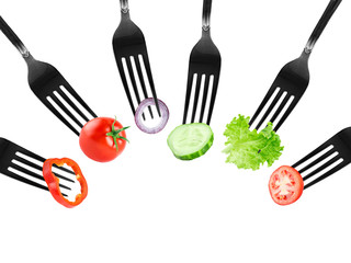 Fruits and vegetables on fork