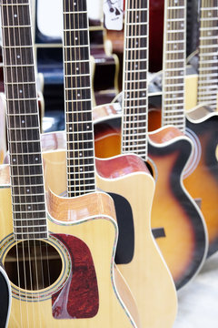 Guitars in the store background