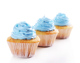Delicious cupcakes isolated on white