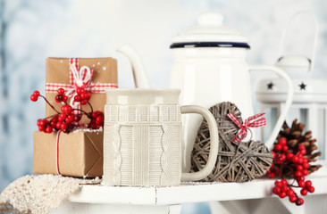 Winter composition with hot beverage on nature background