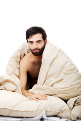 Obraz premium Man waking up in bed.