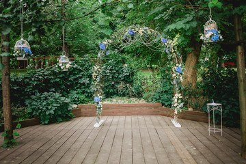 arch in a form offlower composition on a wedding ceremony