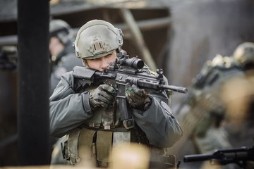 Fototapeta premium military soldier shooting an assault rifle