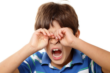 Fototapeta premium Young boy yawning on white background
