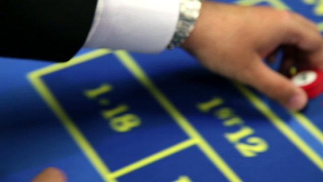 Detail of placing the bat at roulette table
