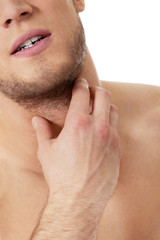 Obraz premium Athletic man feeling pain in his neck.