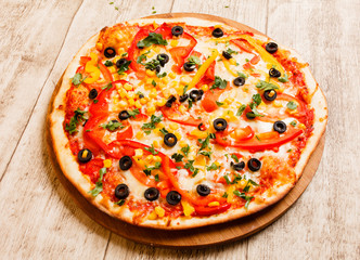 pizza on the wood background