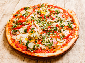 pizza on the wood background