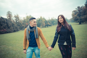 young couple in the park during autumn season outdoor