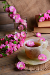 Obraz na płótnie Canvas Beautiful fruit blossom with cup of tea