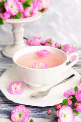 Beautiful fruit blossom with cup of tea