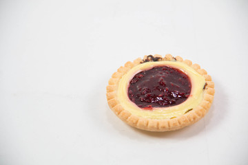 single raspberry jam filled tart