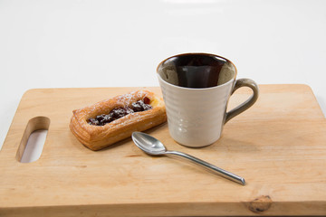 Cup of coffee and danish pastry.