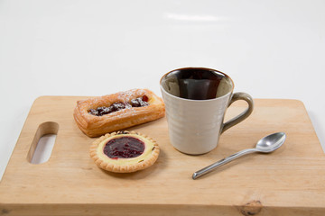 Cup of coffee and danish pastry.