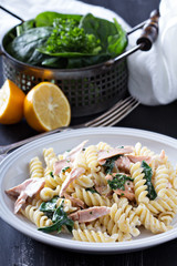 Pasta fusilli with baked salmon and spinach