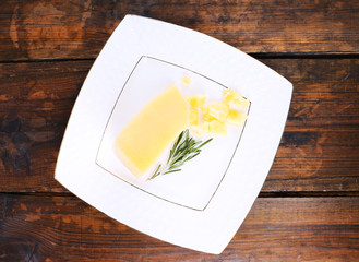 Parmesan cheese with sprig of rosemary